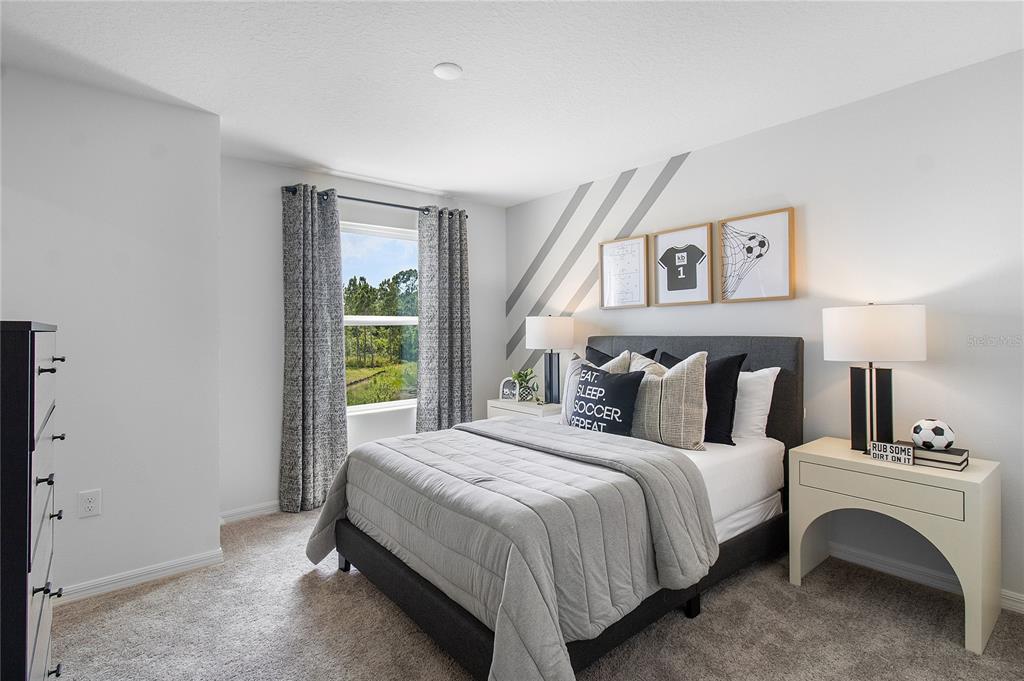 16639 Luminary Loop Clermont, FL 34714 - Photo 12 of 26 a bedroom with a bed and a window