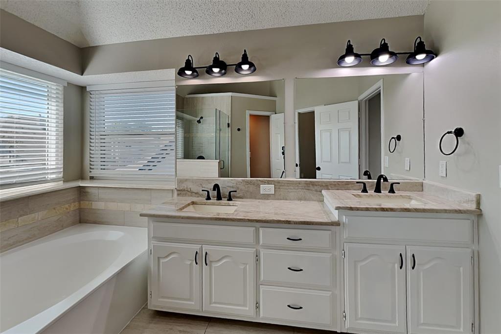 1008 Timberline Lane Allen, TX 75002 - Photo 11 of 25 a bathroom with a sink double vanity and a mirror
