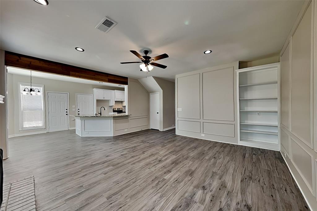 1008 Timberline Lane Allen, TX 75002 - Photo 3 of 25 a view of livingroom with hardwood floor and a ceiling fan