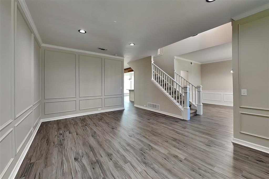 1008 Timberline Lane Allen, TX 75002 - Photo 5 of 25 a view of a hallway with wooden floor