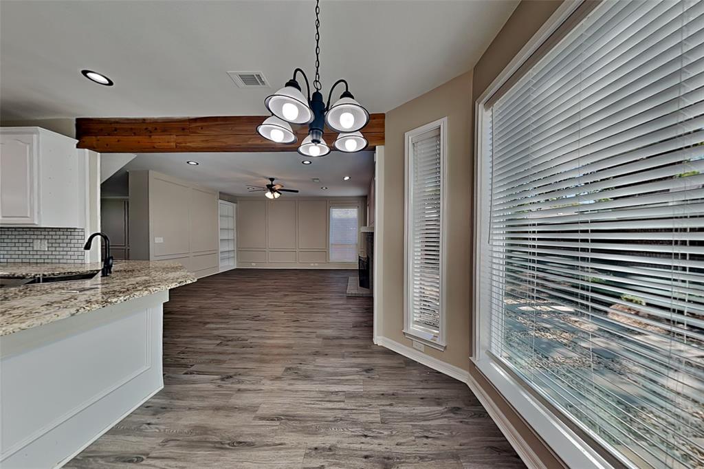 1008 Timberline Lane Allen, TX 75002 - Photo 7 of 25 a view of a kitchen with a sink and wooden floor