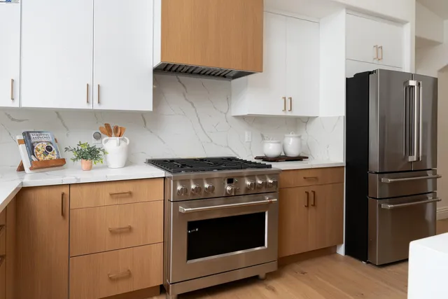 a kitchen with counter top space and living room