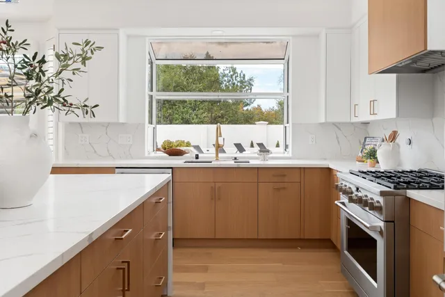 a living room with furniture dining table and a large window