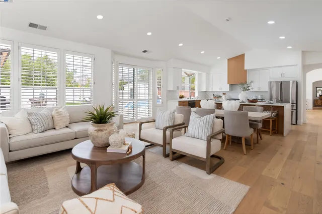 a spacious bedroom with a bed and a large window