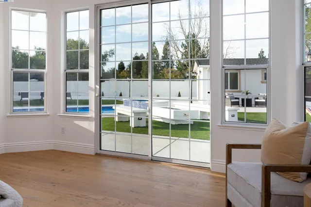 a view of a patio with a table and chairs