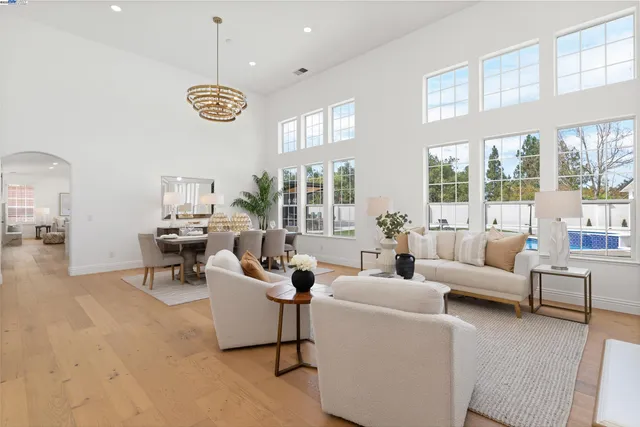 a dining room with furniture a fireplace and wooden floor