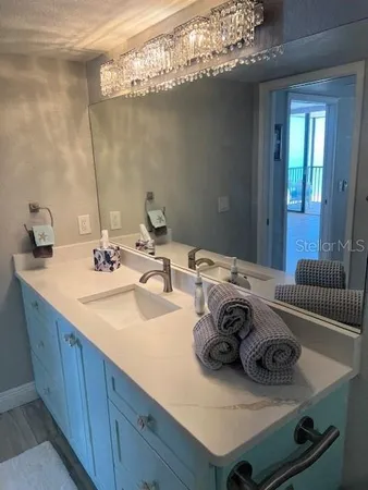 a bathroom with a sink and a mirror