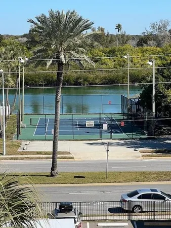 a view of a swimming pool with a bench