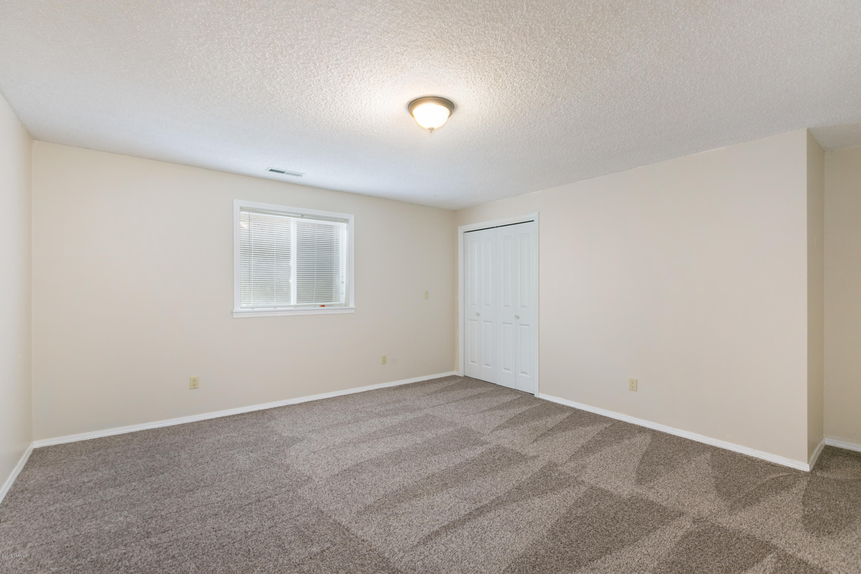 1004 Birchfield Road Yakima, WA 98901 - Photo 19 of 23 a view of an empty room with a window