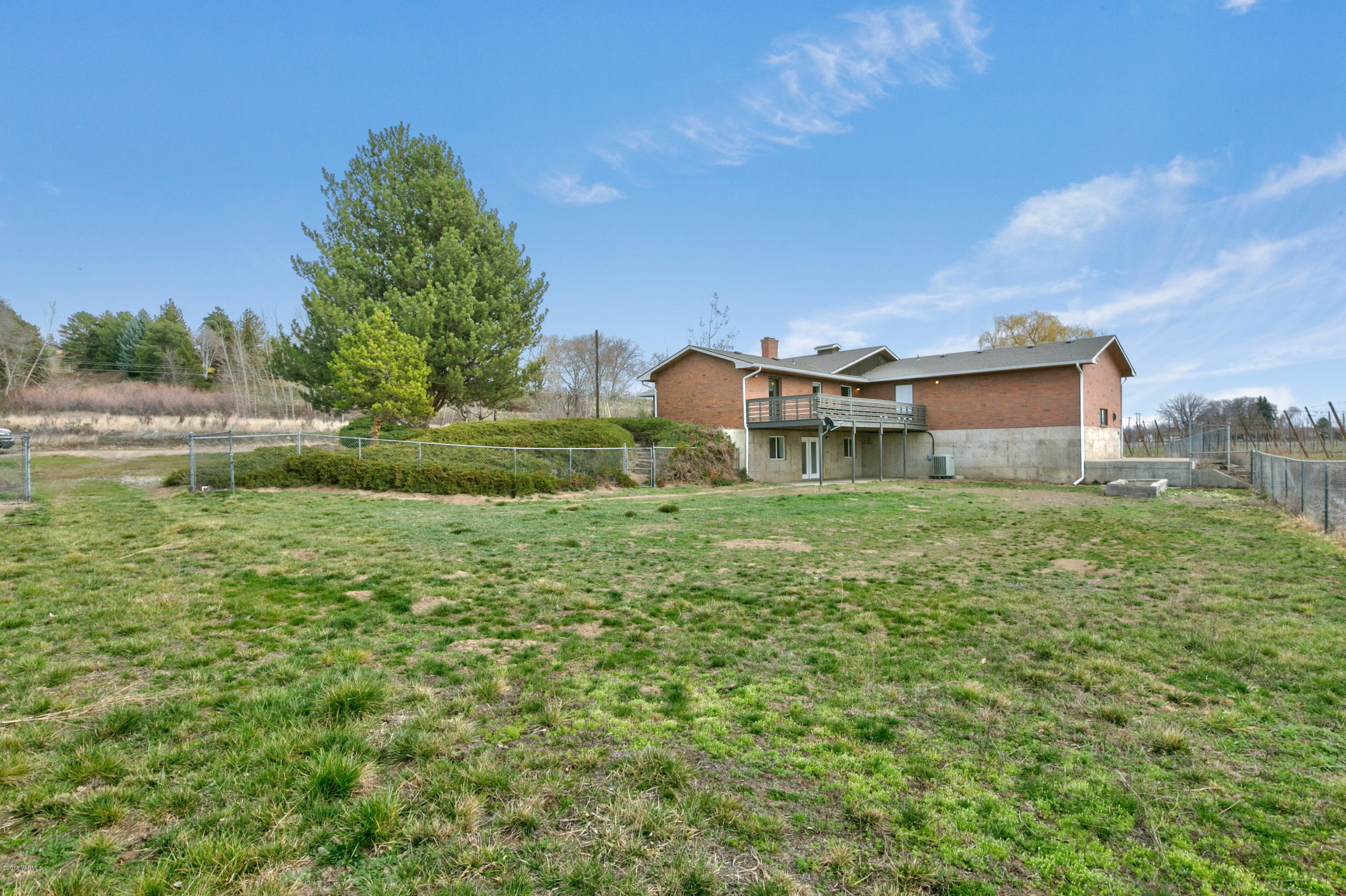 1004 Birchfield Road Yakima, WA 98901 - Photo 4 of 23 a view of a house with a big yard
