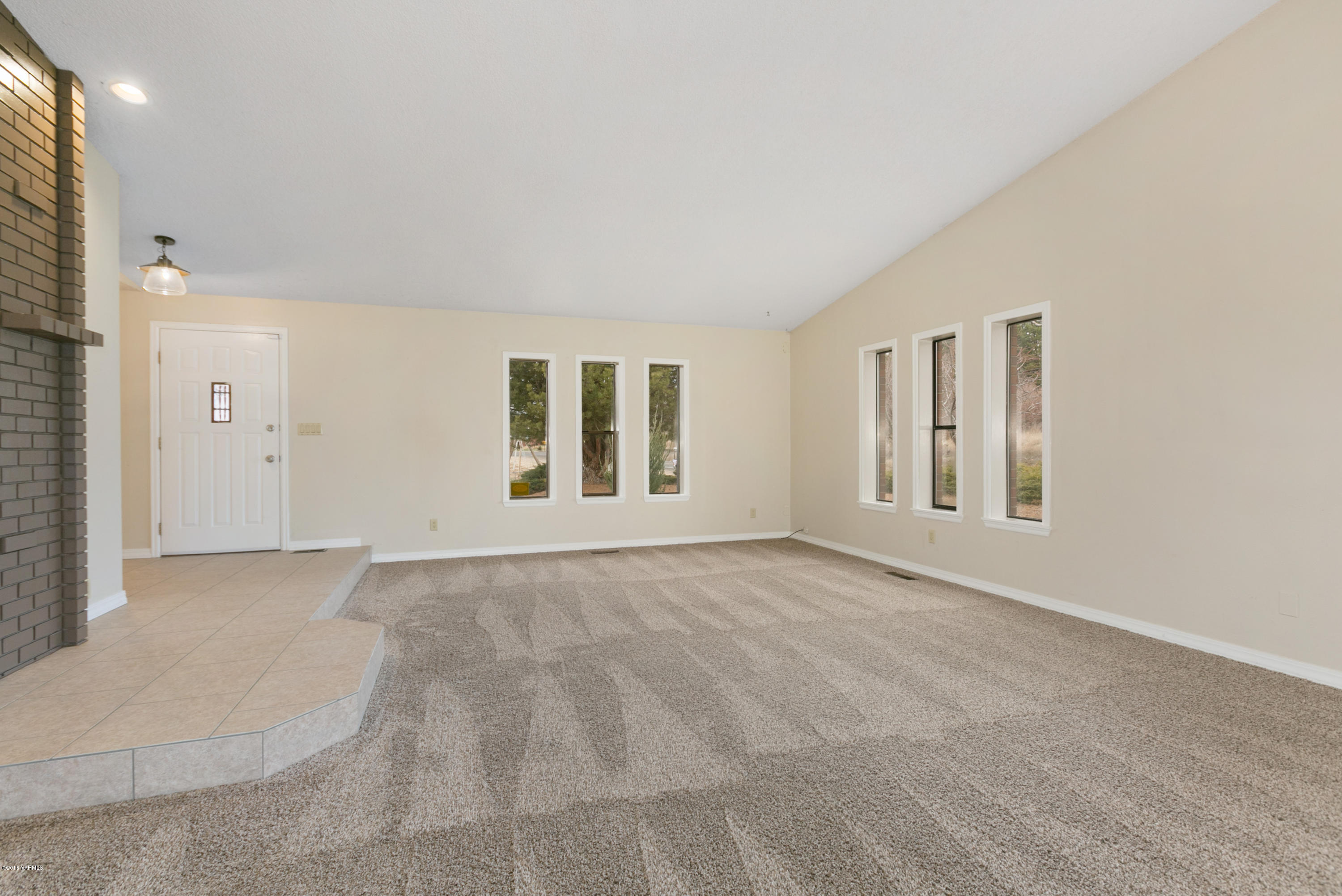 1004 Birchfield Road Yakima, WA 98901 - Photo 8 of 23 a view of an empty room with a window