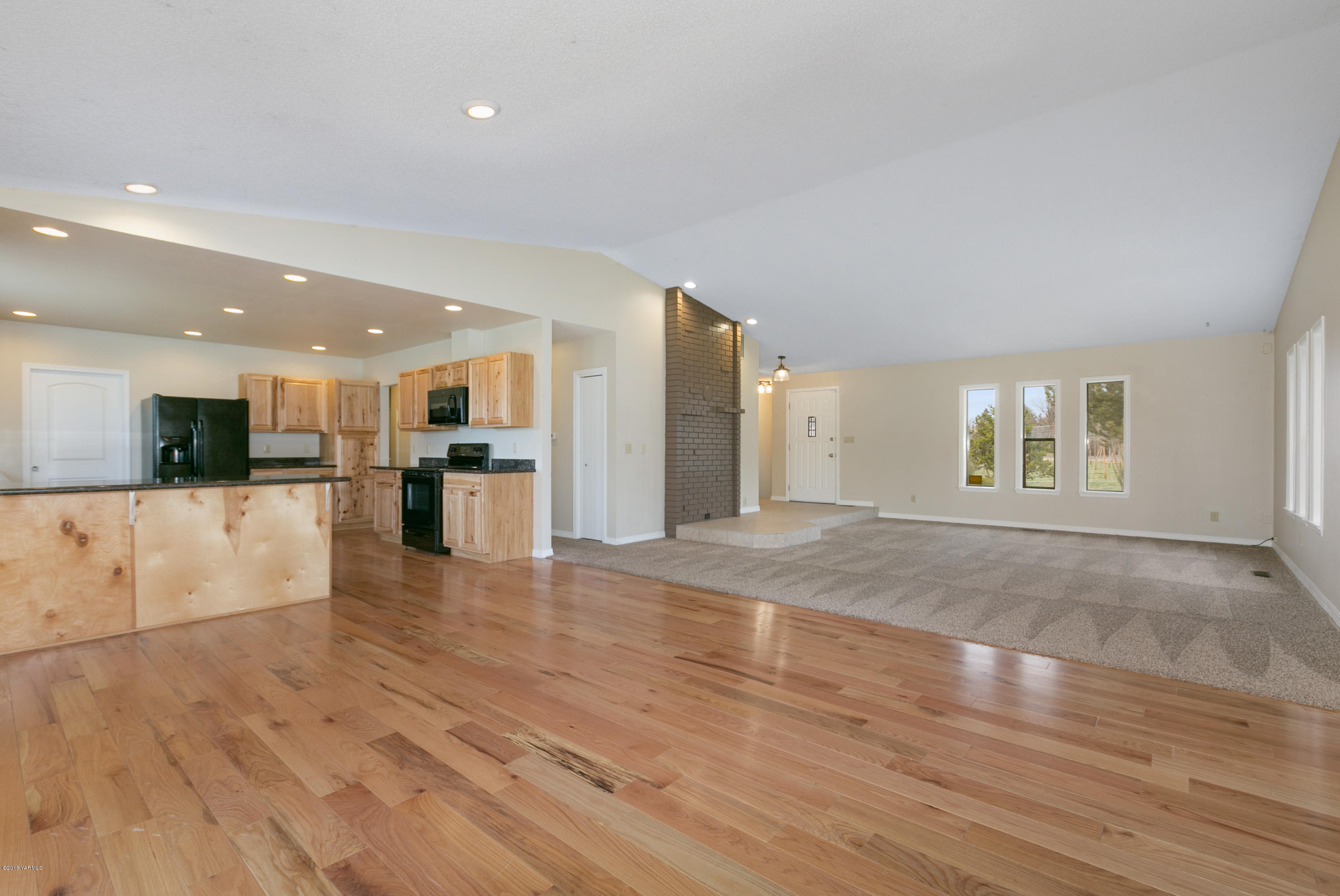 1004 Birchfield Road Yakima, WA 98901 - Photo 10 of 23 a view of kitchen and hall with wooden floor