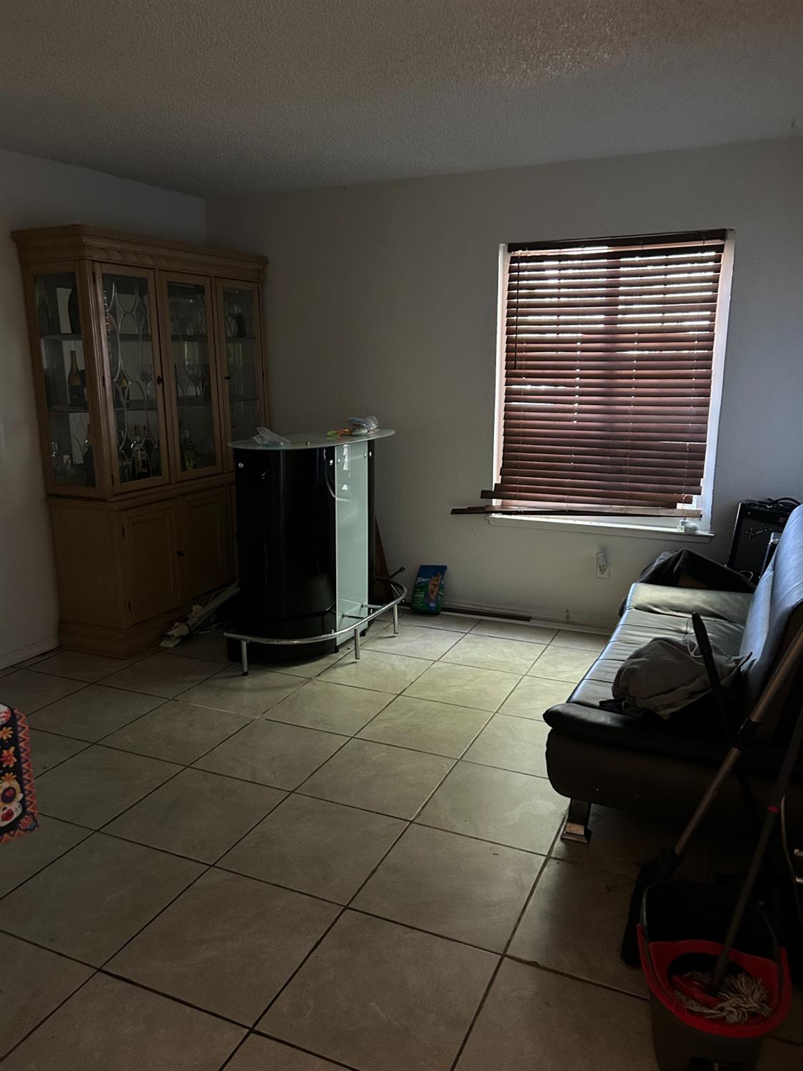 629 E Fort Modesto, CA 95354 - Photo 9 of 16 a room with furniture and a window