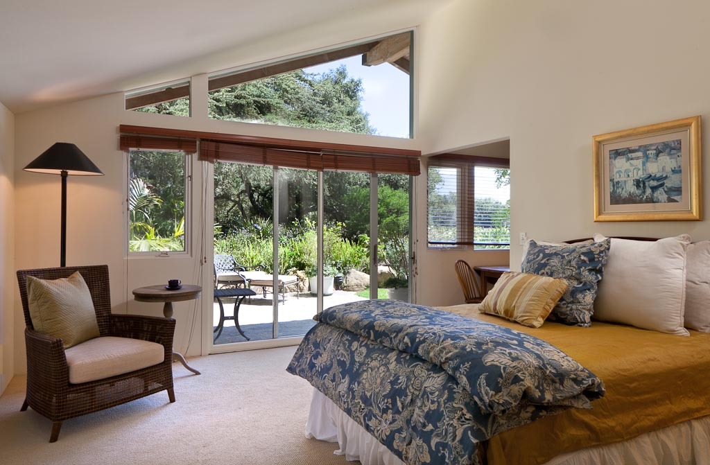 350 Woodley Road Santa Barbara, CA 93108 - Photo 13 of 26 a bedroom with a large bed and a large window