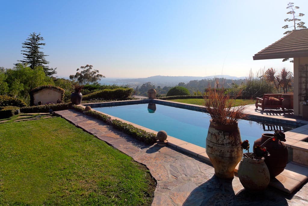 350 Woodley Road Santa Barbara, CA 93108 - Photo 17 of 26 a view of a swimming pool with a table and chairs