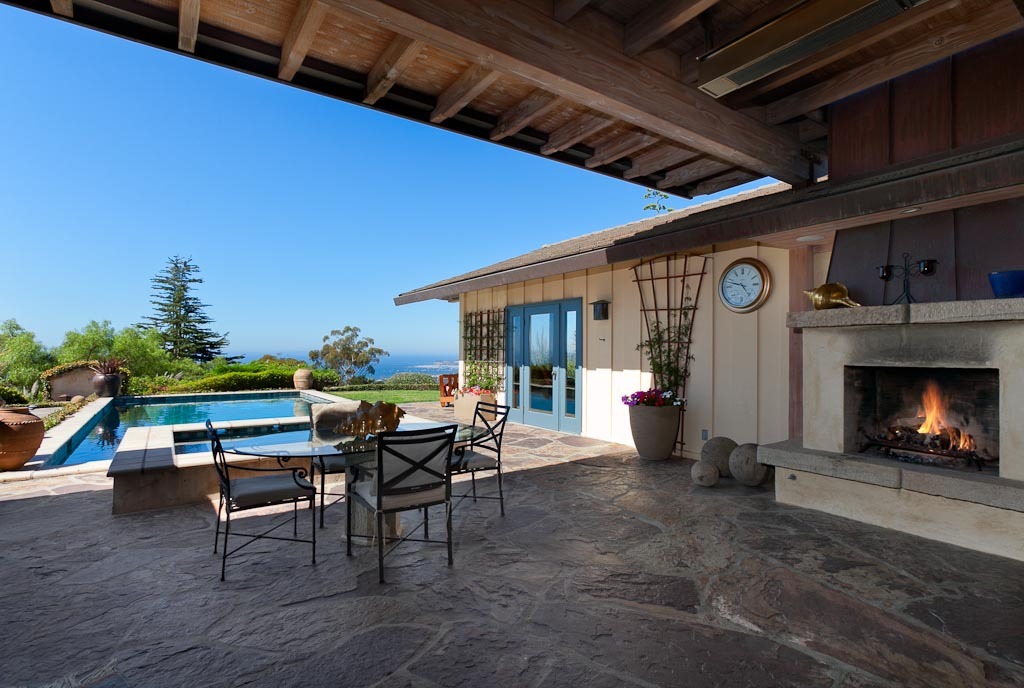 350 Woodley Road Santa Barbara, CA 93108 - Photo 22 of 26 a view of a porch with dining table and chairs with wooden floor