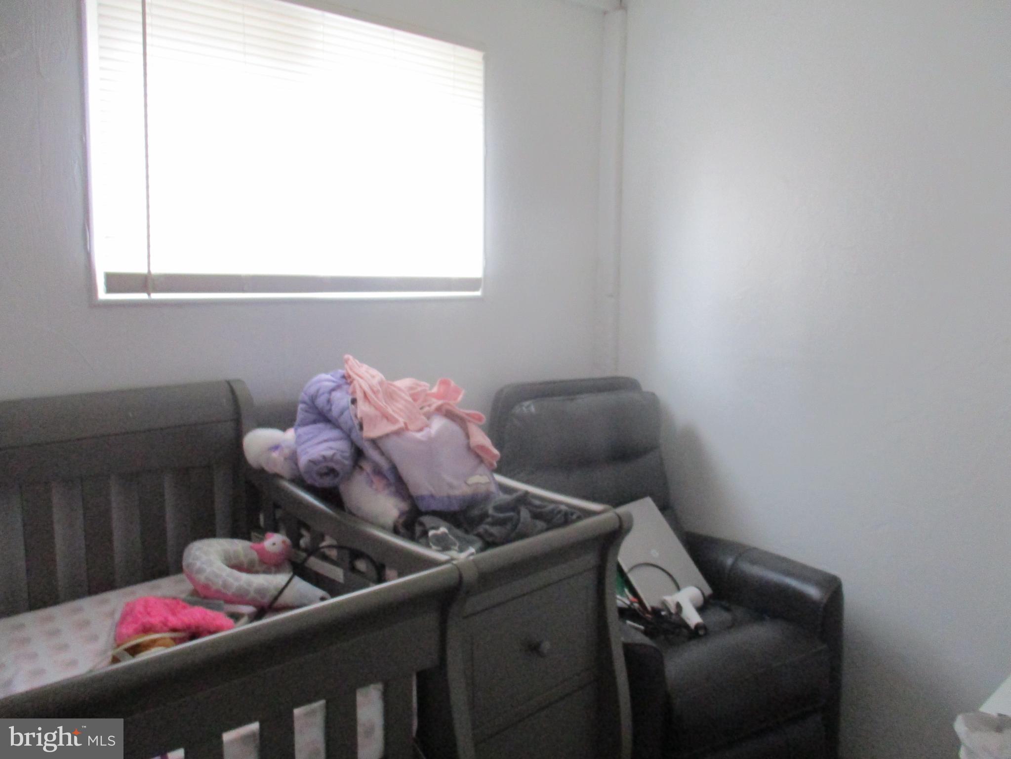 122 Hewitt Street Trenton, NJ 08611 - Photo 11 of 15 a bathroom with a sink and a mirror