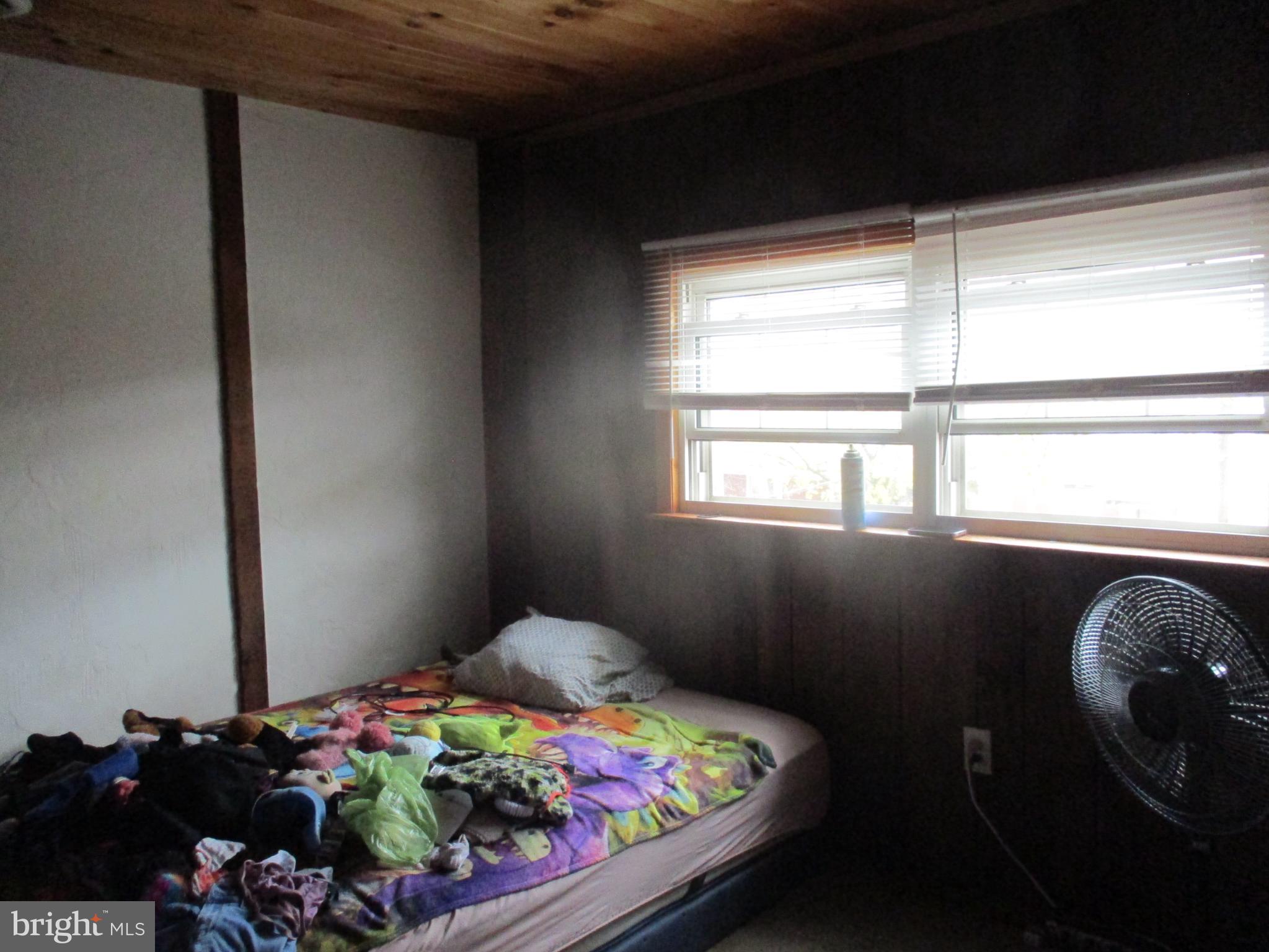 122 Hewitt Street Trenton, NJ 08611 - Photo 12 of 15 a bedroom with a bed and a window