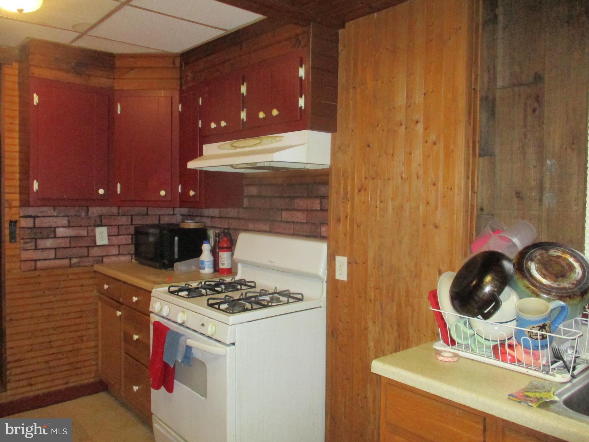 122 Hewitt Street Trenton, NJ 08611 - Photo 6 of 15 a kitchen with a stove and a sink