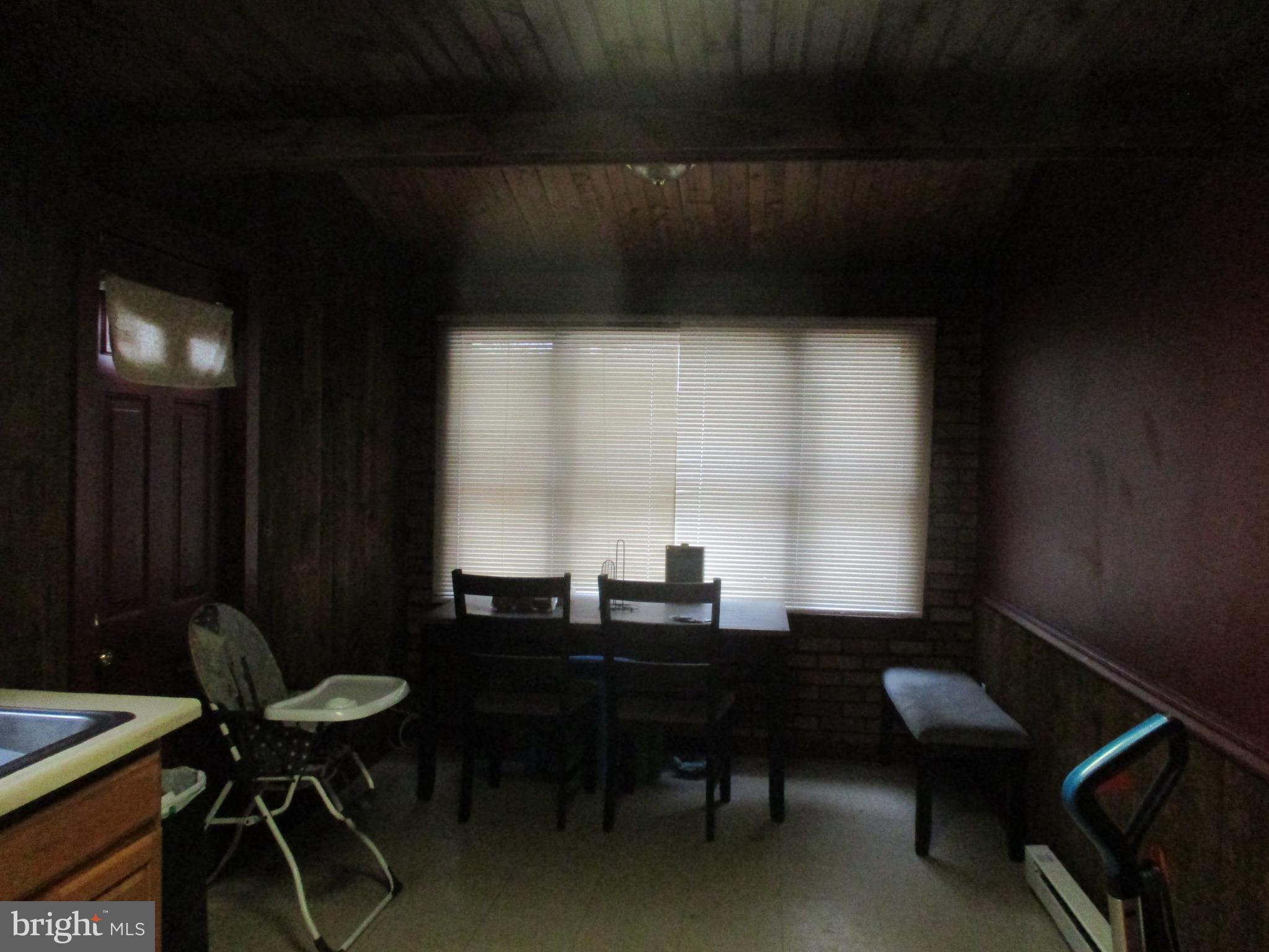 122 Hewitt Street Trenton, NJ 08611 - Photo 8 of 15 a view of a workspace with furniture and a window