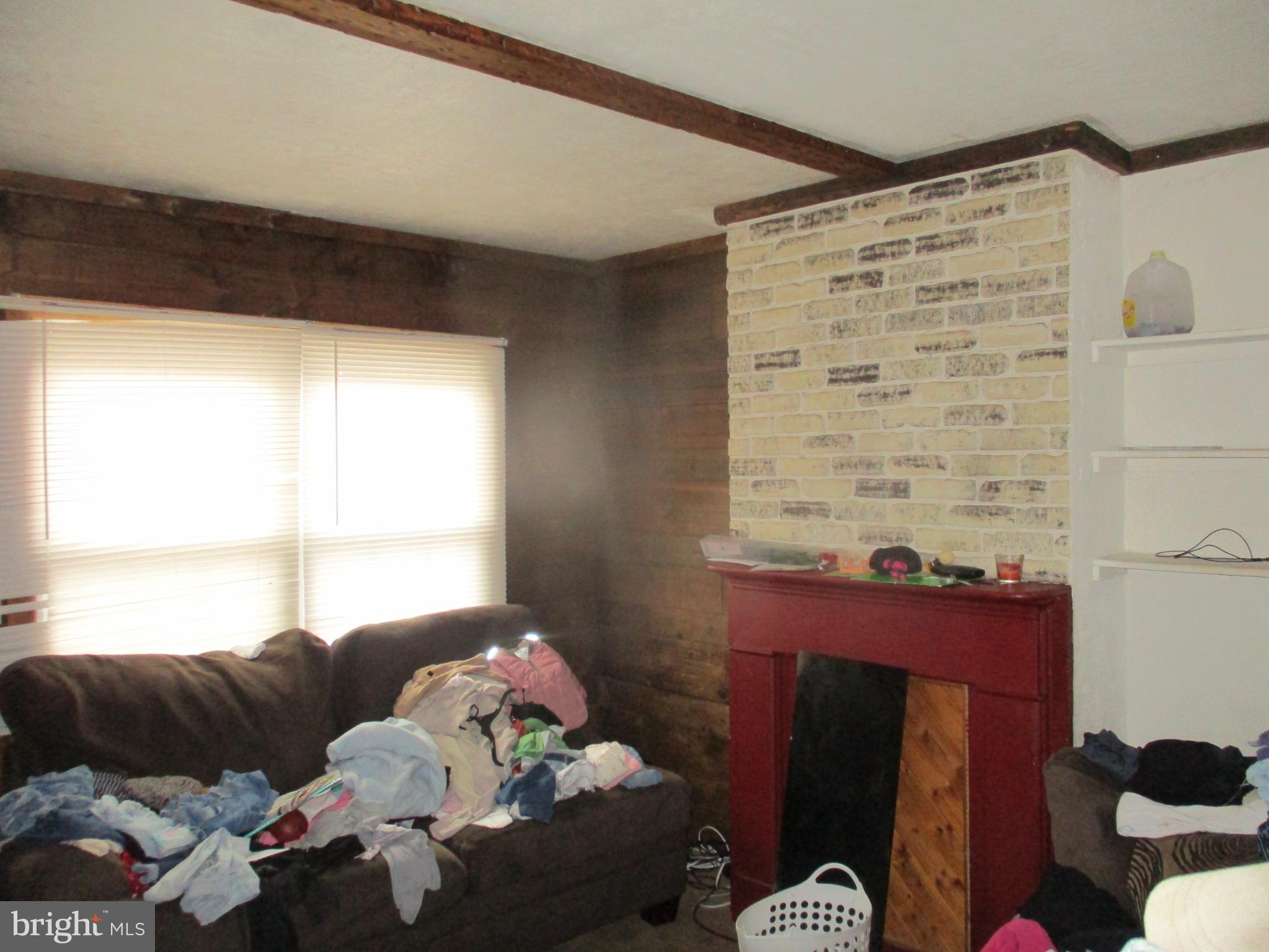 122 Hewitt Street Trenton, NJ 08611 - Photo 10 of 15 a living room with furniture and a window