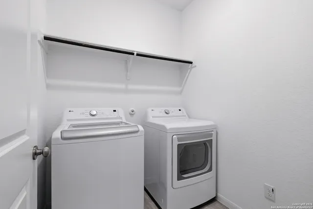 a utility room with dryer and washer