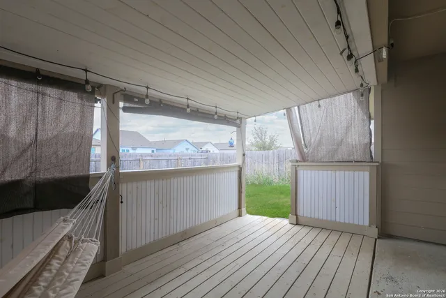 a view of front door and wooden floor