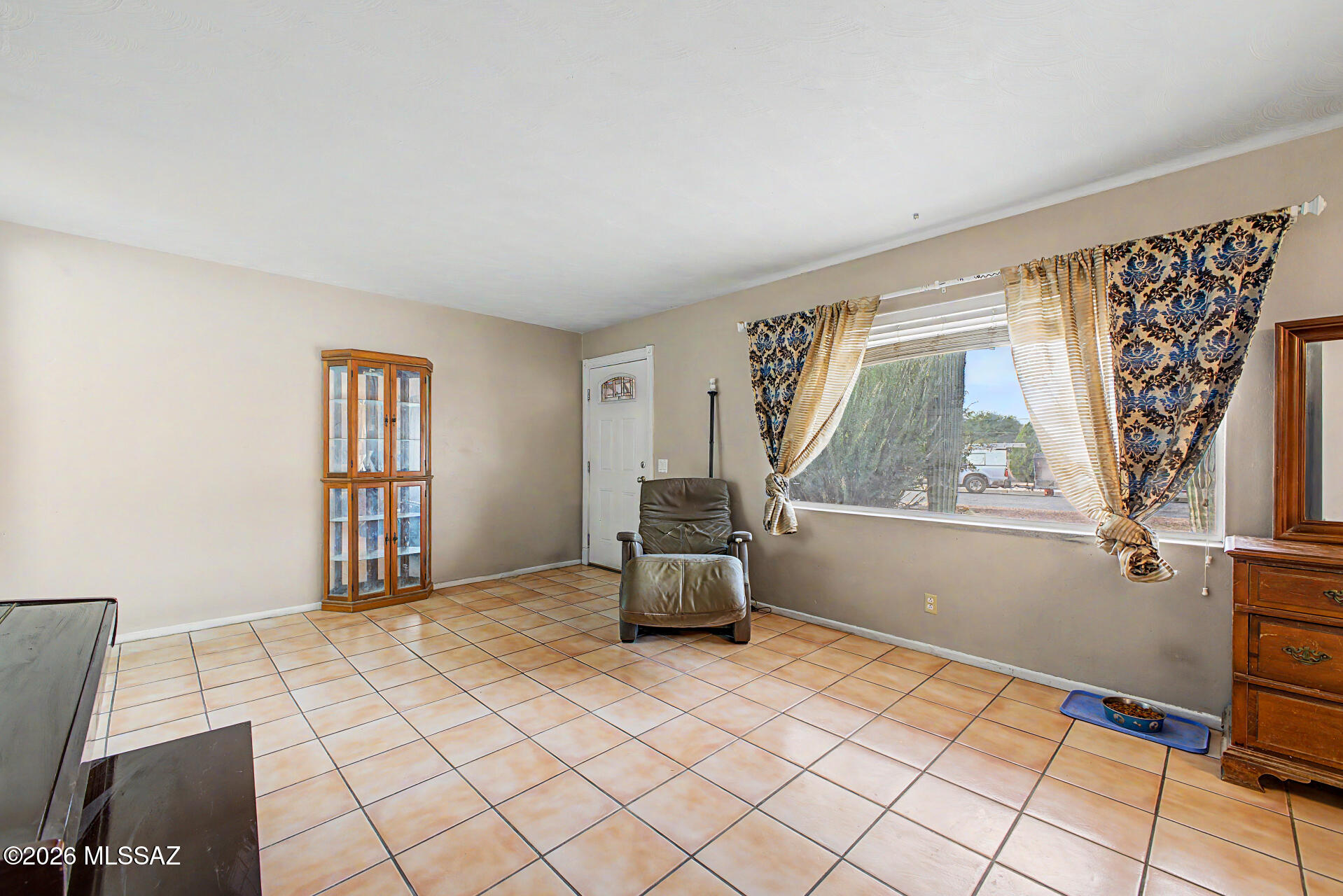 1172 East Allen Road Tucson, AZ 85719 - Photo 4 of 25 a bedroom with a bed and wooden floor