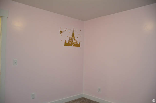 1842 South 1280th Street West Logan, UT 84321 - Photo 14 of 21 Pink-painted walls with white trim and a textured ceiling