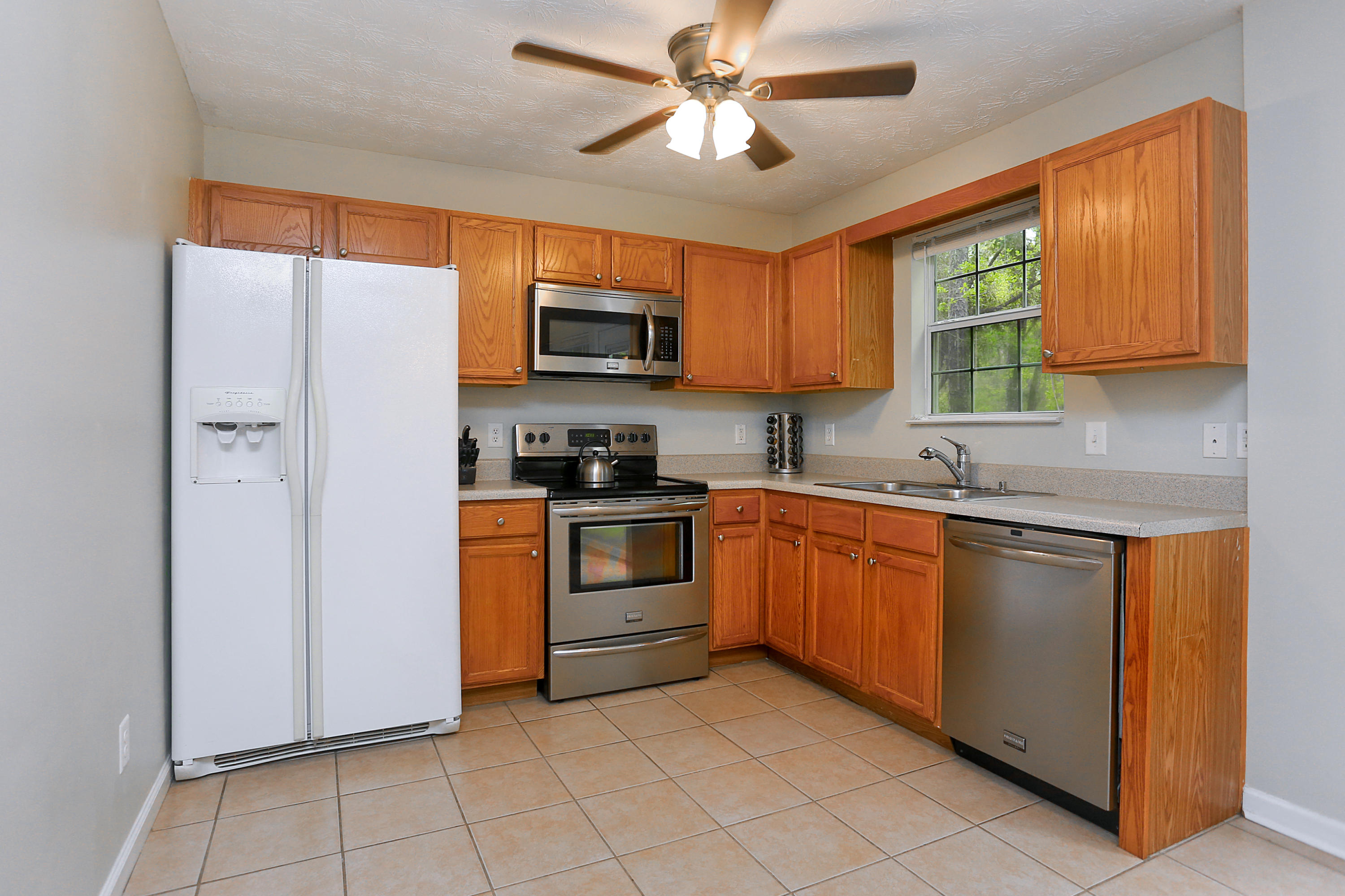 781 Bay Grove Road Freeport, FL 32439 - Photo 4 of 19 a kitchen with stainless steel appliances granite countertop a refrigerator a stove top oven a sink and dishwasher