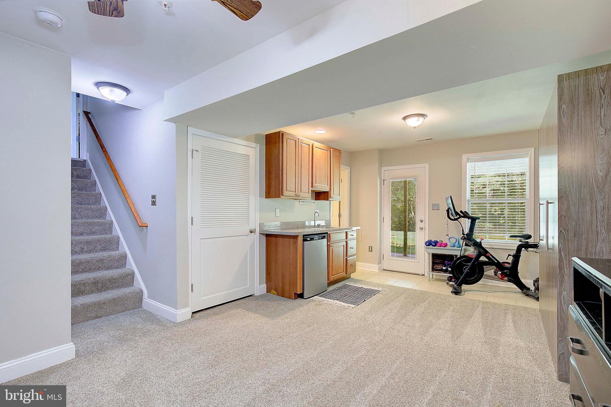 7006 Prout Road Friendship, MD 20758 - Photo 22 of 48 a living room with furniture and a fireplace
