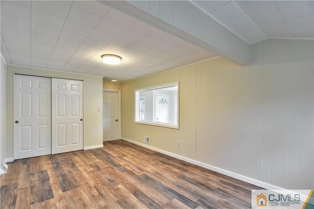 113 Stony Road Edison, NJ 08817 - Photo 11 of 20 a view of an empty room and window
