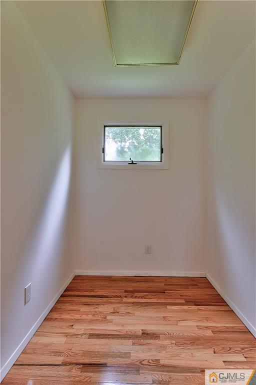 113 Stony Road Edison, NJ 08817 - Photo 17 of 20 a view of empty room with wooden floor