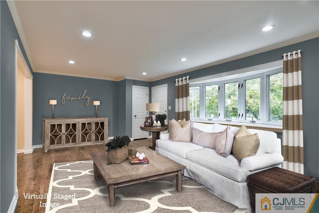 113 Stony Road Edison, NJ 08817 - Photo 4 of 20 a living room with furniture and a large window