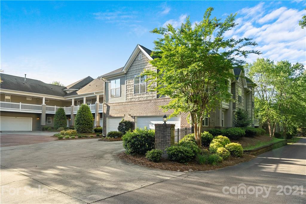 8929 Rosalyn Glen Road, Unit 108 Cornelius, NC 28031 - Photo 28 of 28 a front view of a house with a yard
