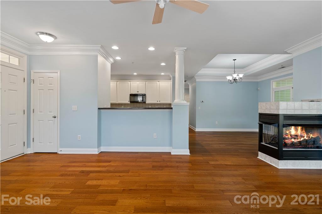 8929 Rosalyn Glen Road, Unit 108 Cornelius, NC 28031 - Photo 5 of 28 a view of a kitchen and an empty room