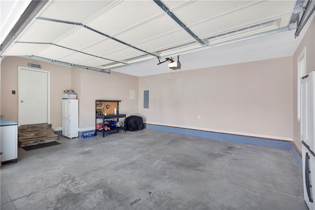 131 Morgan Road West Union, SC 29696 - Photo 25 of 39 A spacious garage with a durable concrete floor offers practical utility and direct home access.