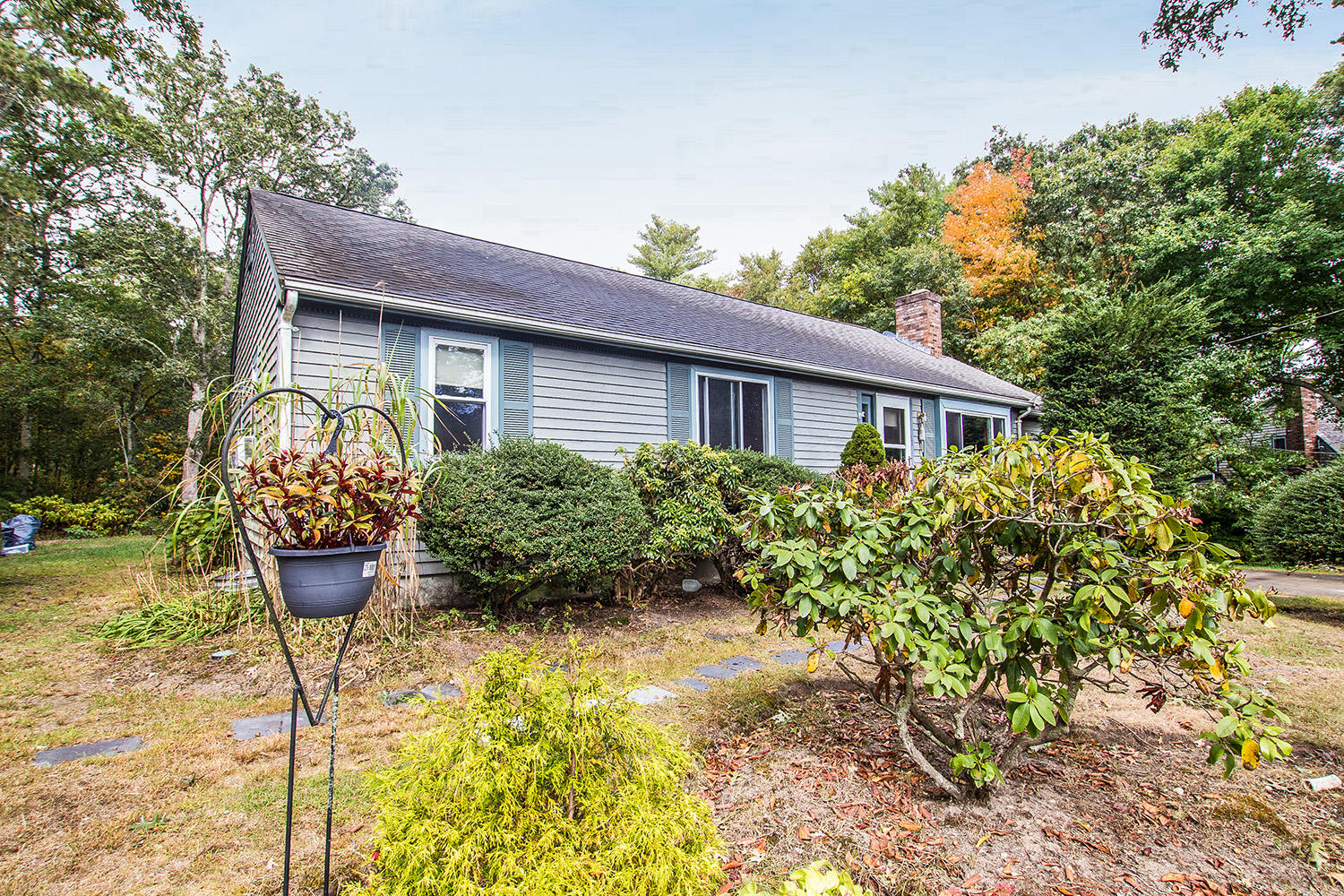 58 Ensign Road Centerville, MA 02632 - Photo 2 of 12 a view of a house with potted plants