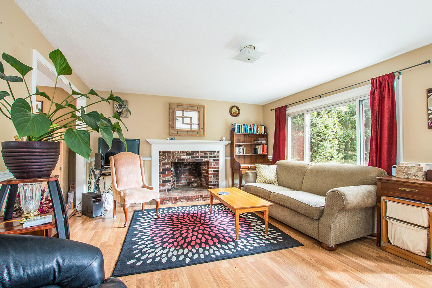 58 Ensign Road Centerville, MA 02632 - Photo 3 of 12 a living room with furniture a rug and a fireplace