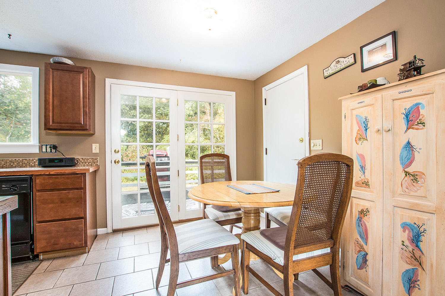 58 Ensign Road Centerville, MA 02632 - Photo 5 of 12 a view of a dining room with furniture window and outside view