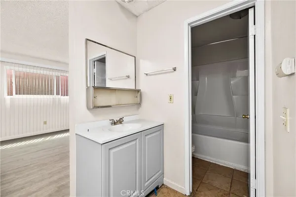 a bathroom with a toilet and a bathtub