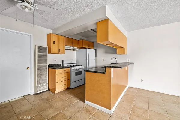 a view of a kitchen with furniture and a kitchen view