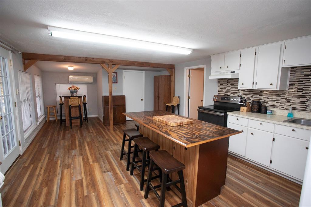 9051 Lacy Road Graford, TX 76449 - Photo 8 of 23 View from Living Room to Kitchen and dining area. New French Doors opening out onto the deck.