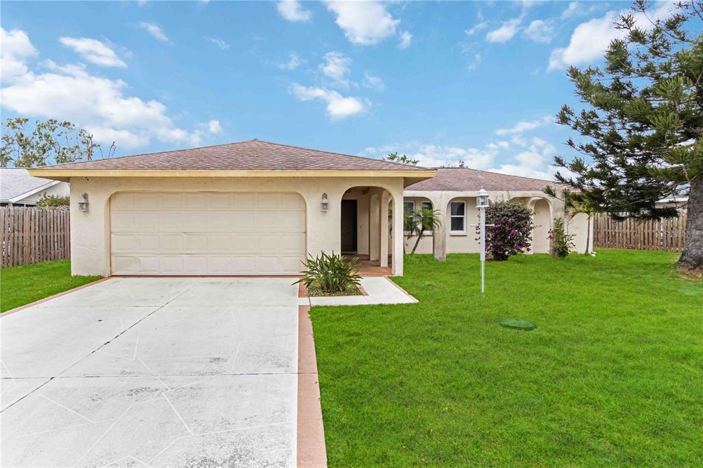 3121 Mohawk Street Sarasota, FL 34231 - Photo 1 of 1 a front view of a house with garden