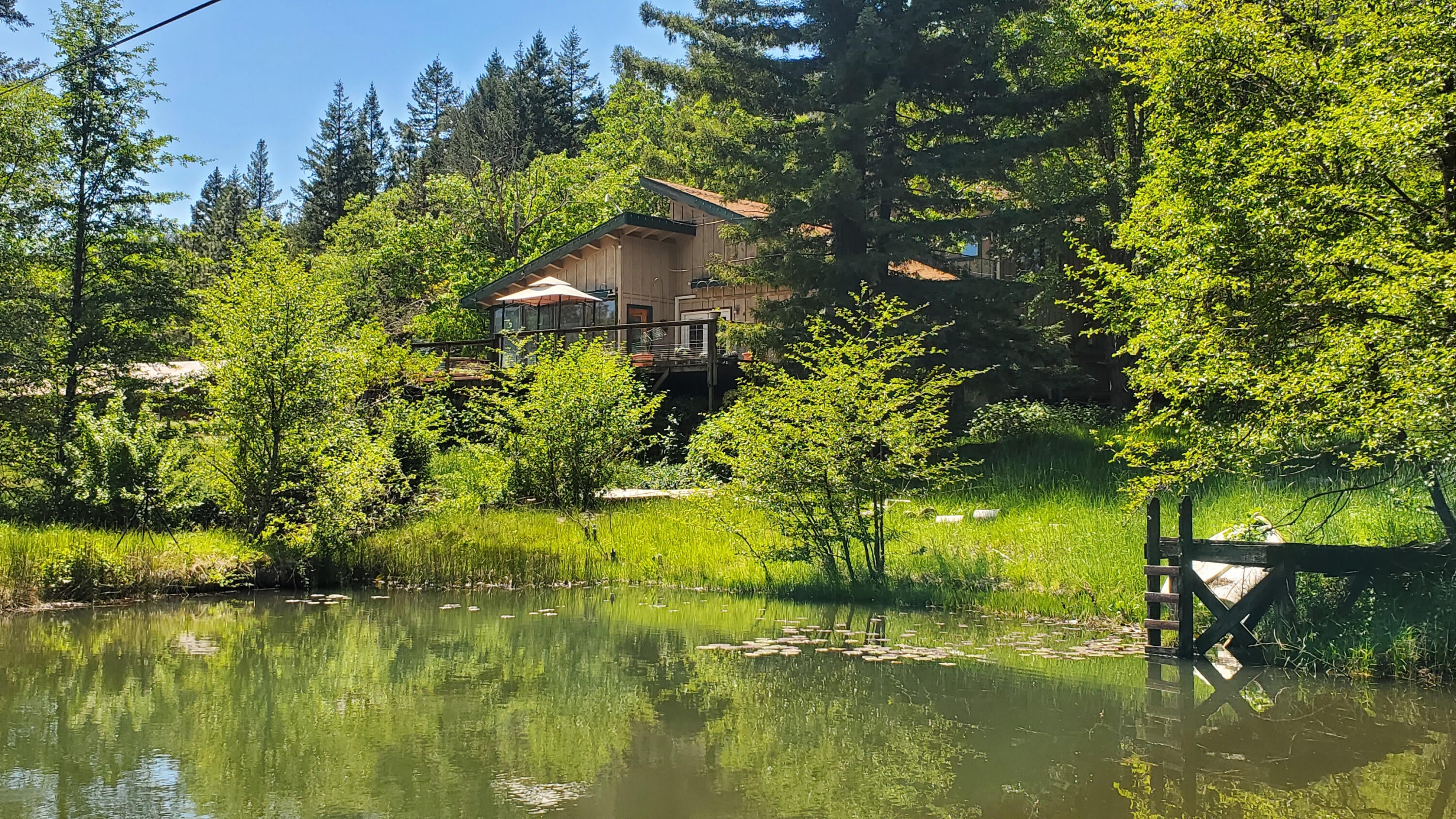 6016-6110 West Side Road Cave Junction, OR 97523 - Photo 4 of 67 2 House over Pond