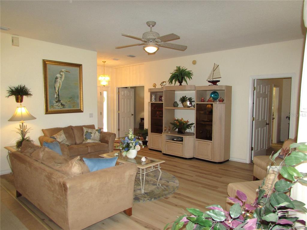 19367 Southwest 101st Place Road Dunnellon, FL 34432 - Photo 11 of 38 a living room with furniture and a large window
