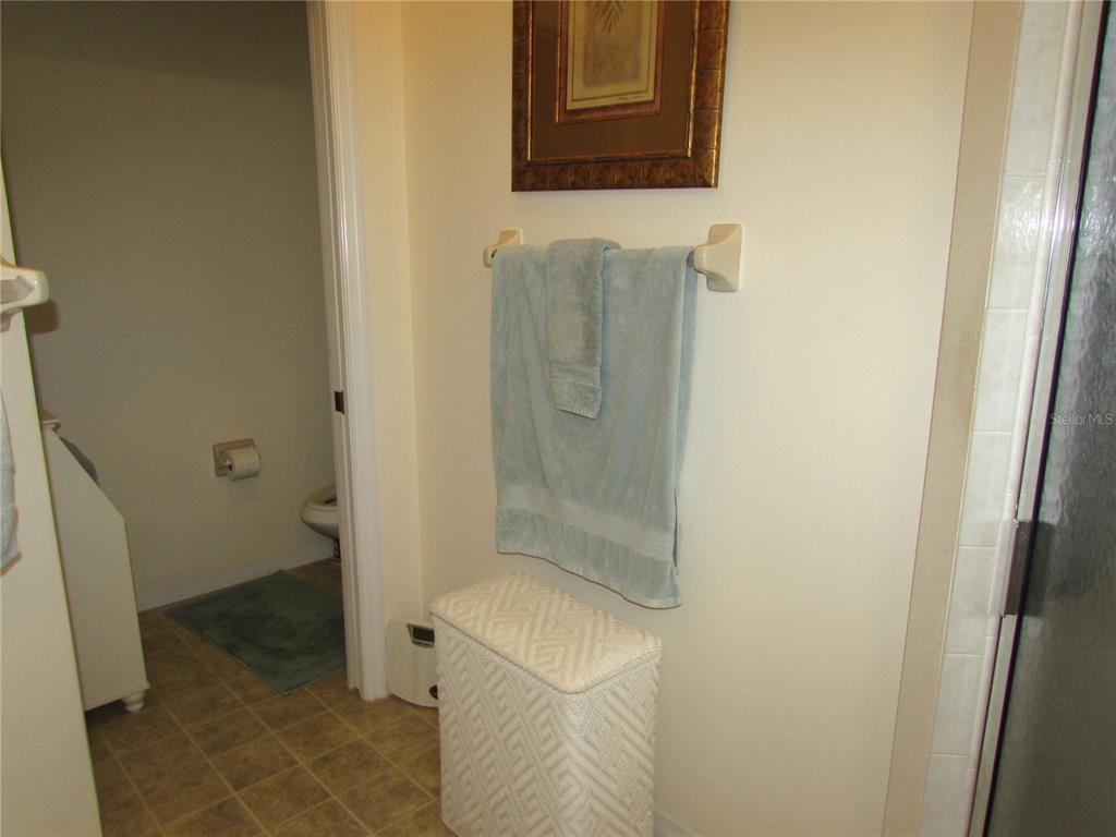 19367 Southwest 101st Place Road Dunnellon, FL 34432 - Photo 17 of 38 a bathroom with a granite countertop shower and a toilet