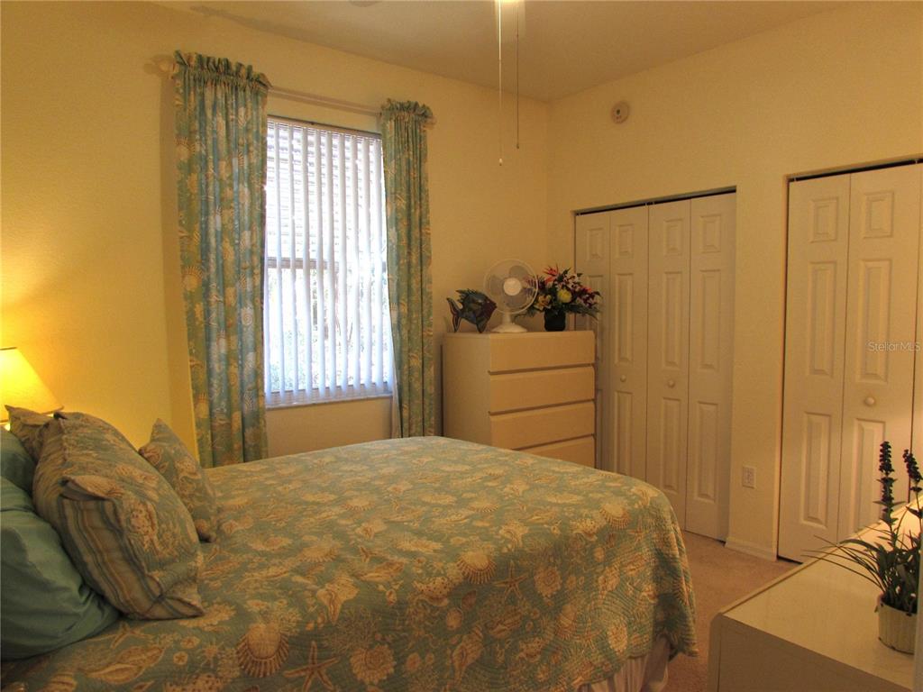 19367 Southwest 101st Place Road Dunnellon, FL 34432 - Photo 20 of 38 a bedroom with a bed and a window