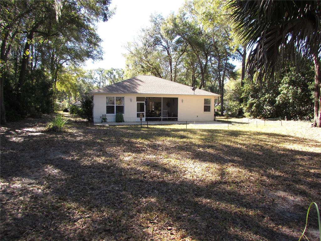 19367 Southwest 101st Place Road Dunnellon, FL 34432 - Photo 25 of 38 a view of a house with a yard
