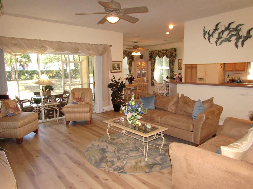 19367 Southwest 101st Place Road Dunnellon, FL 34432 - Photo 6 of 38 a living room with furniture and a large window